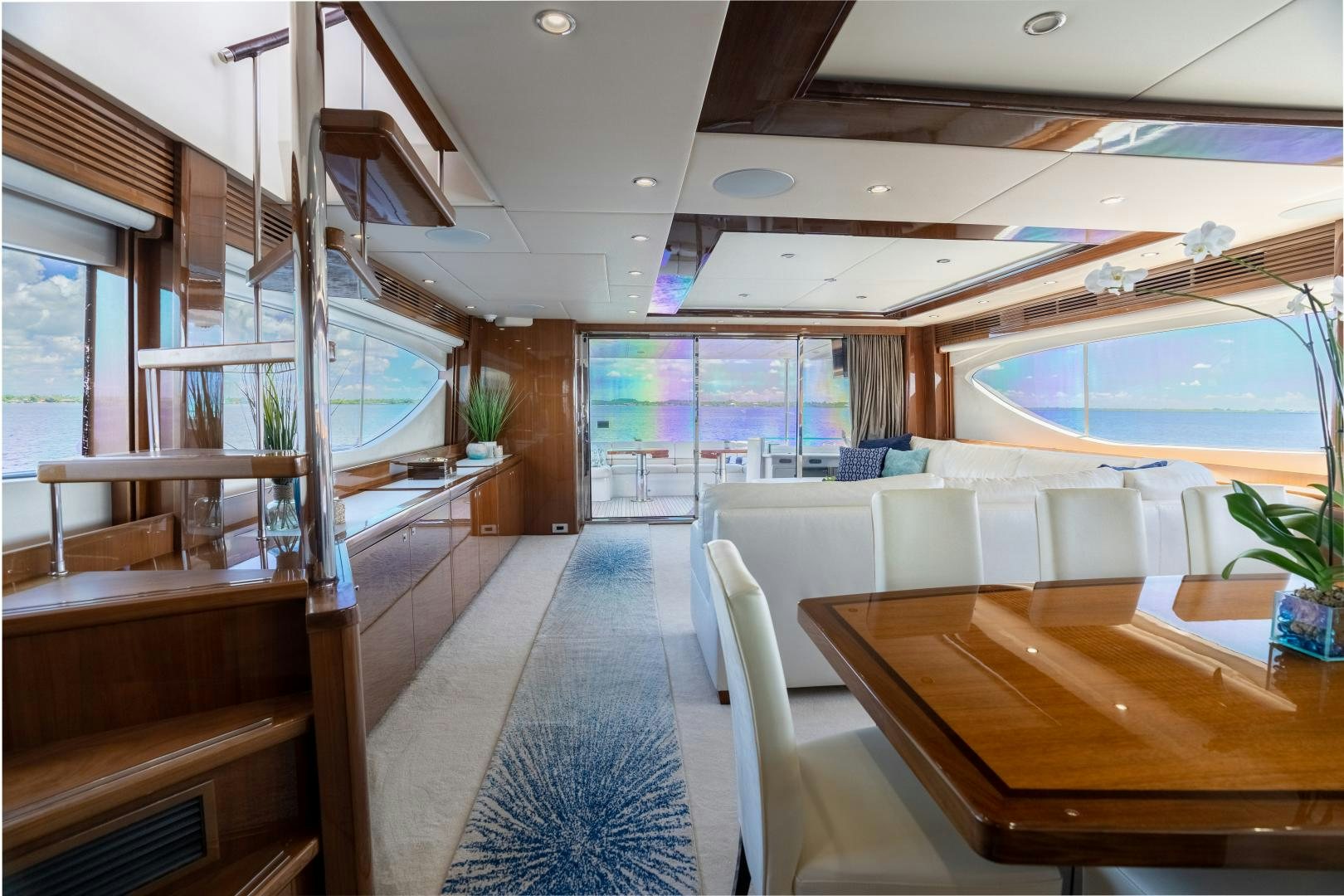 a room with a table and chairs aboard STEPHANIE Yacht for Sale