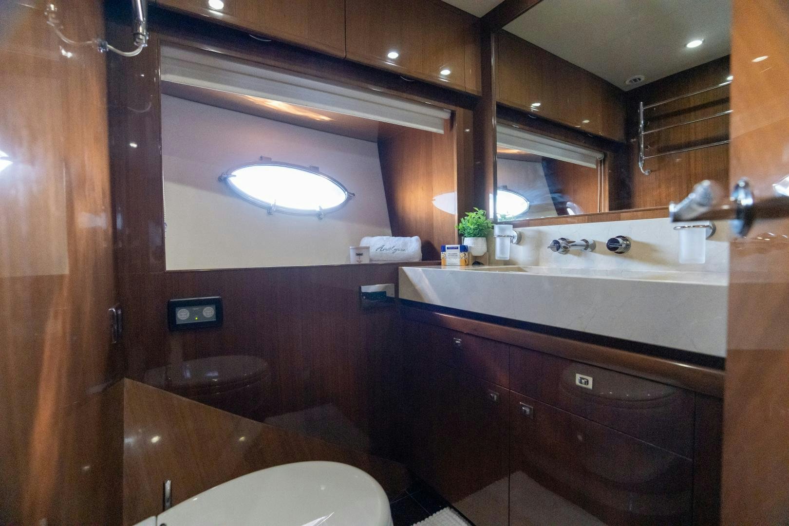 a bathroom with a large mirror aboard STEPHANIE Yacht for Sale
