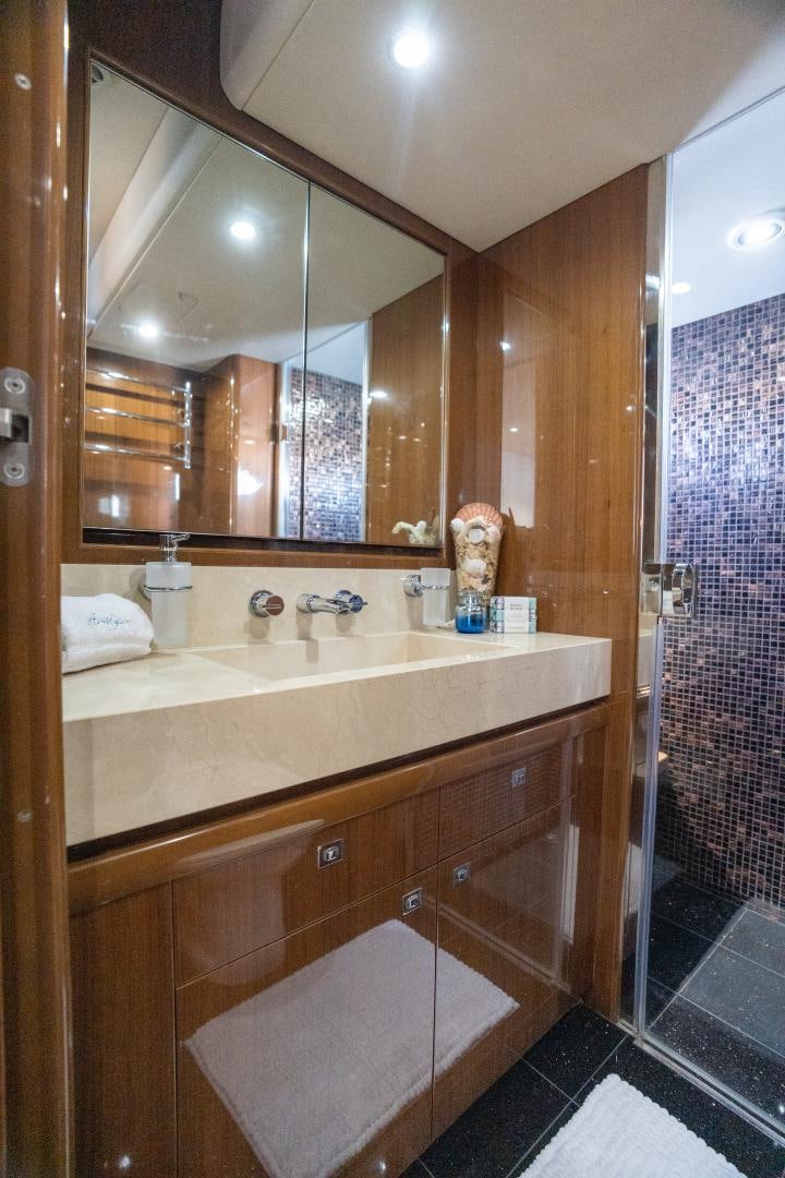 a bathroom with a sink and a mirror aboard STEPHANIE Yacht for Sale