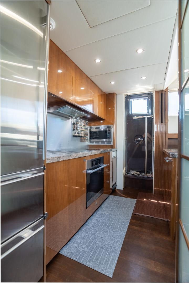 a kitchen with a stainless steel oven aboard STEPHANIE Yacht for Sale