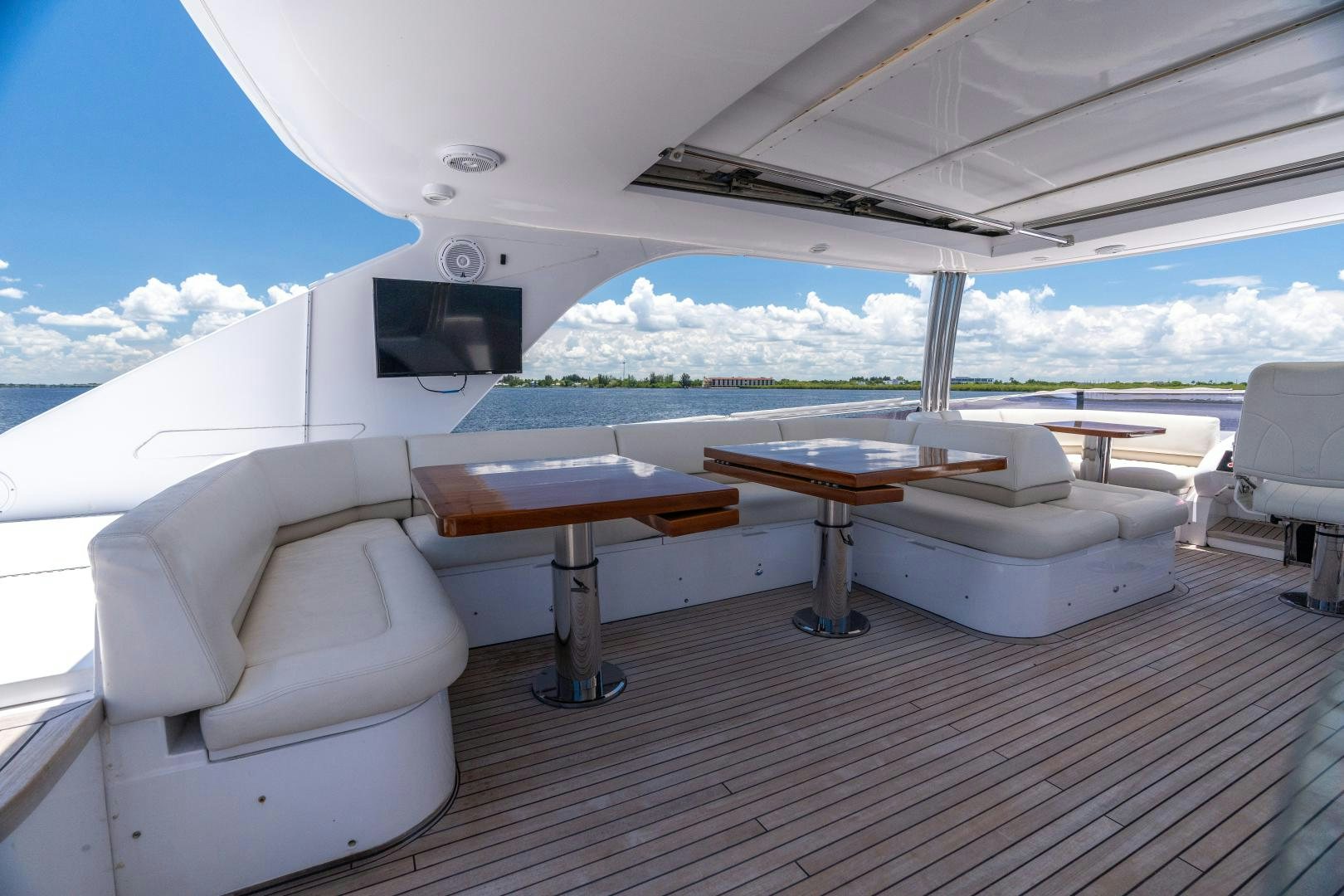 a room with a table and chairs aboard STEPHANIE Yacht for Sale