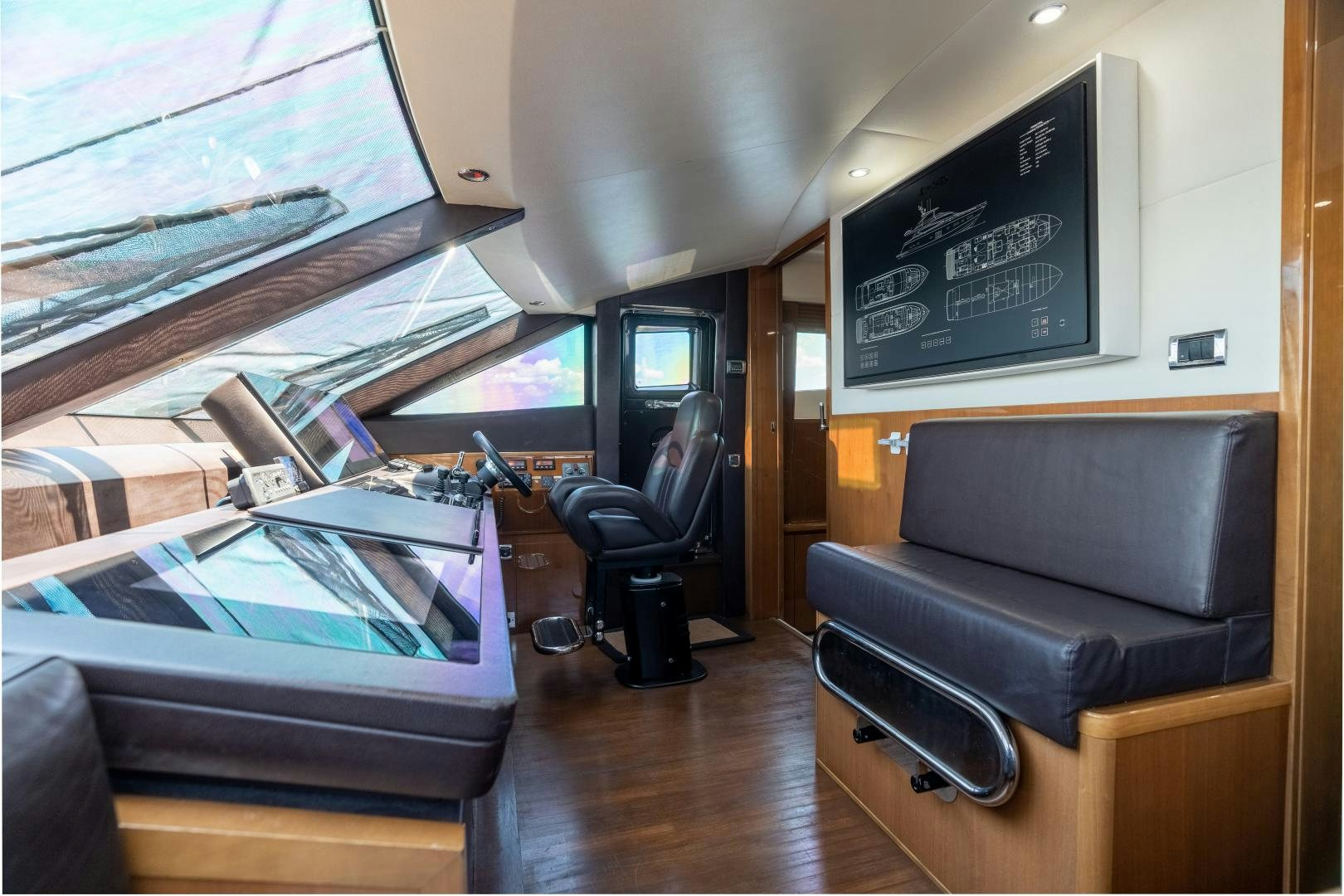 a room with a couch and a tv aboard STEPHANIE Yacht for Sale