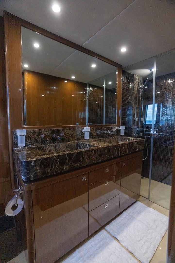 a bathroom with a marble counter top aboard STEPHANIE Yacht for Sale