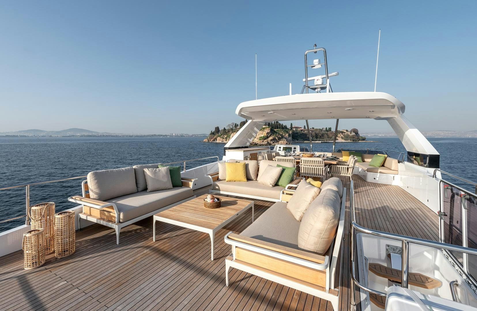 a deck with a large white boat on it and a couch on it aboard NUMARINE 22XP Yacht for Sale