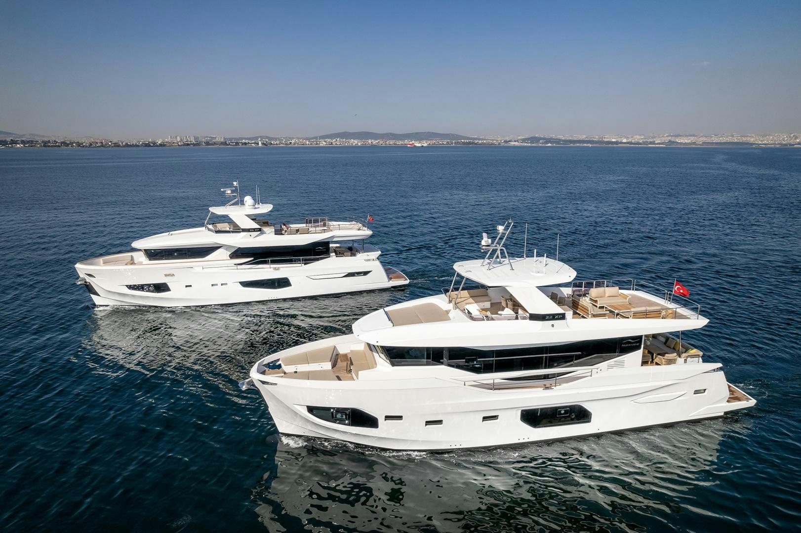 a couple of white yachts in the water aboard NUMARINE 22XP Yacht for Sale