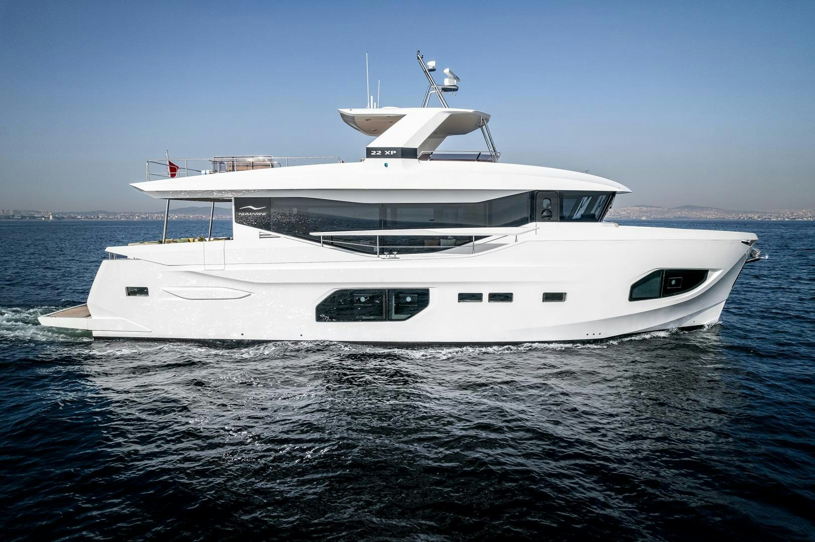 a white yacht in the water aboard NUMARINE 22XP Yacht for Sale
