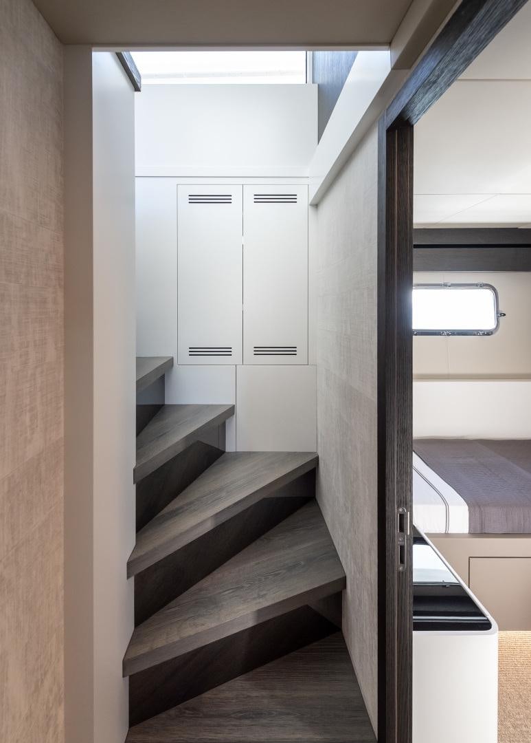 a hallway with white doors aboard NUMARINE 22XP Yacht for Sale