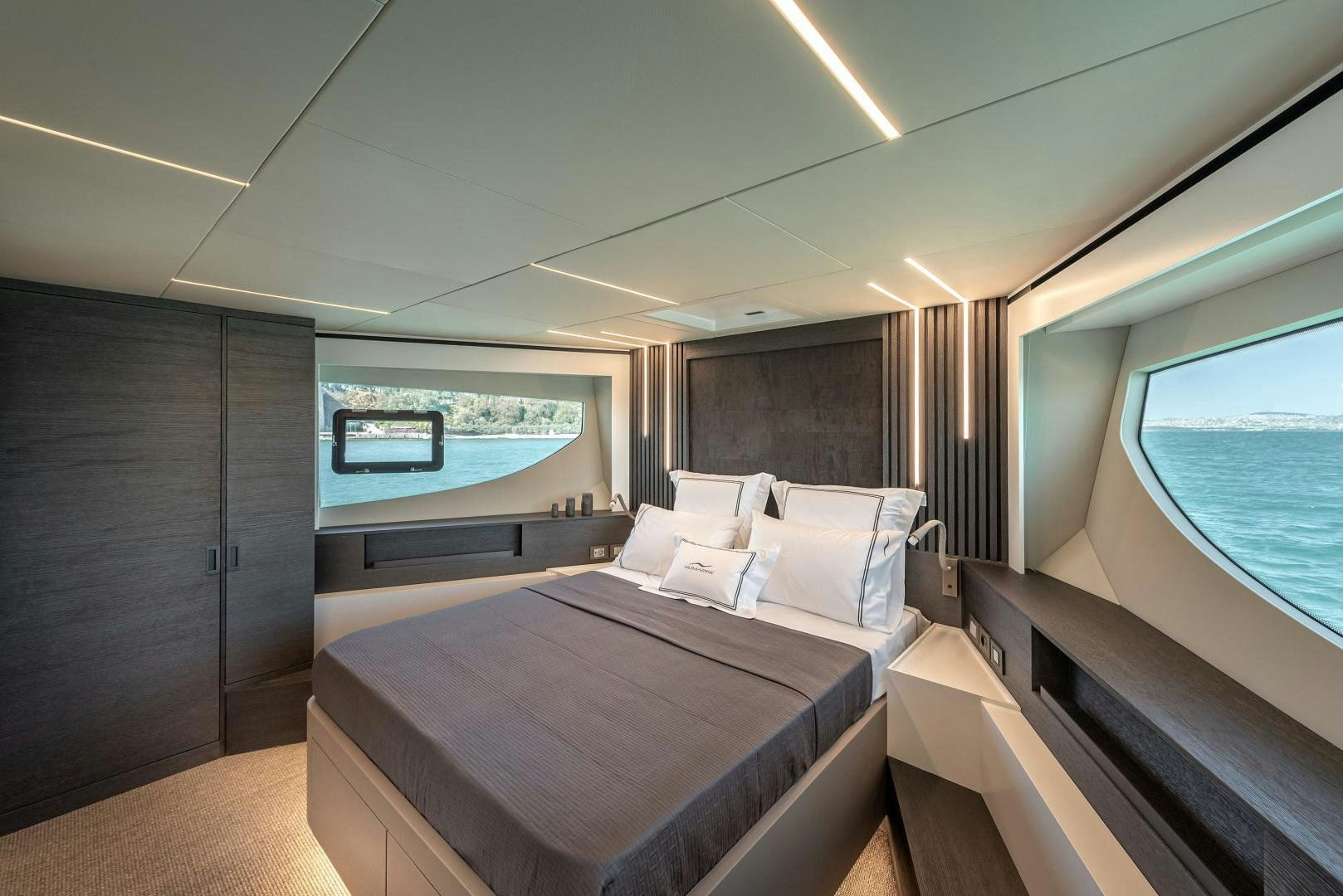 a room with a bed and a window aboard NUMARINE 22XP Yacht for Sale