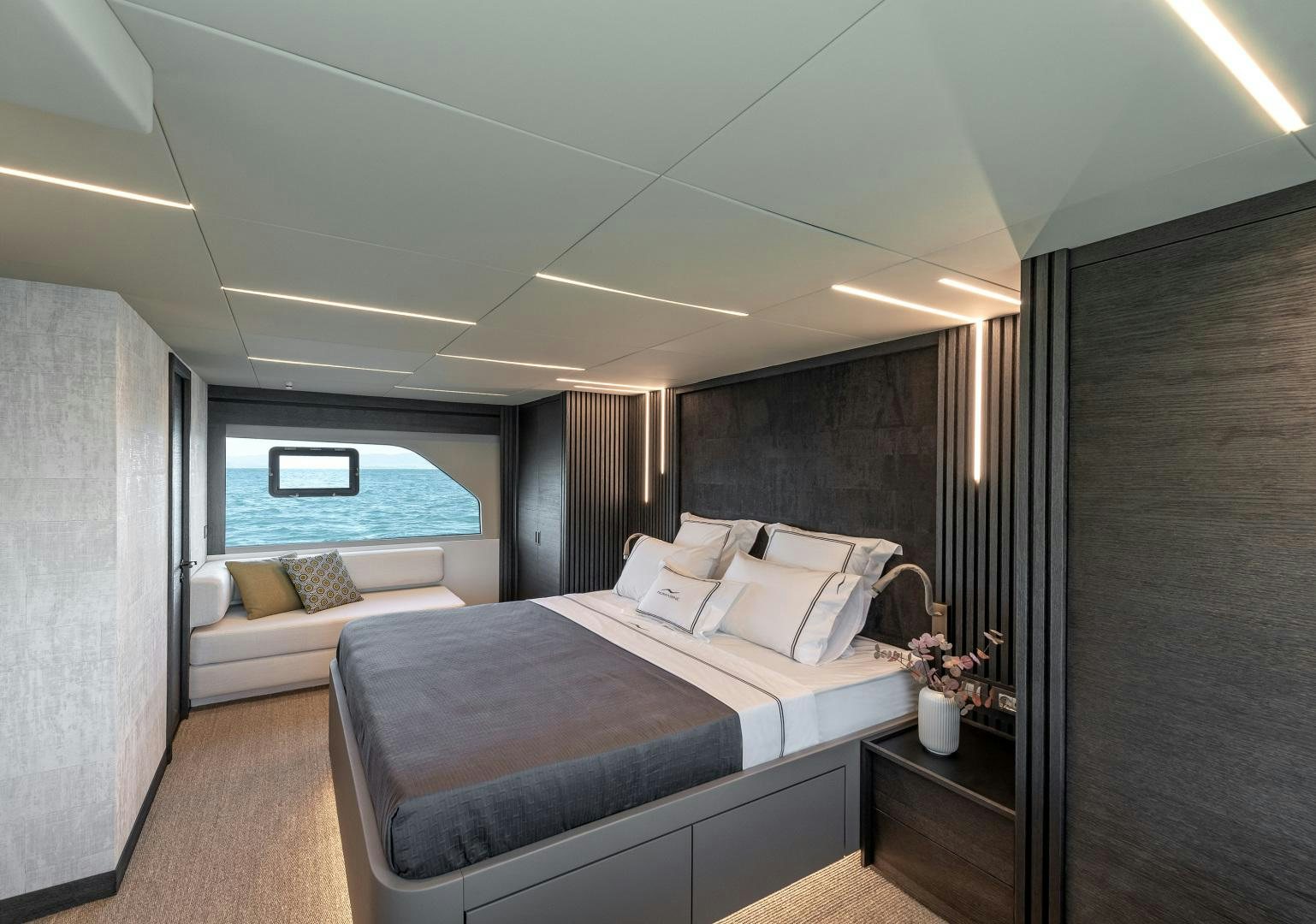 a room with a bed and a window aboard NUMARINE 22XP Yacht for Sale