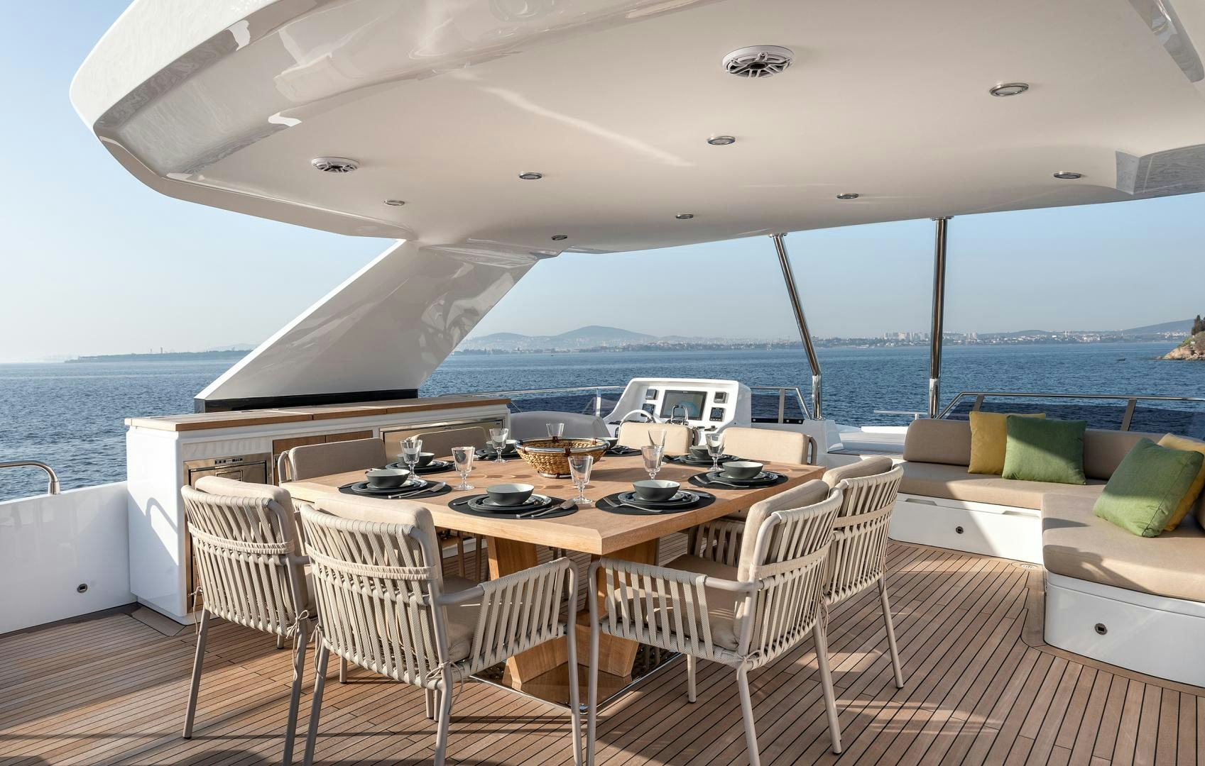 a large room with a table and chairs and a large body of water aboard NUMARINE 22XP Yacht for Sale