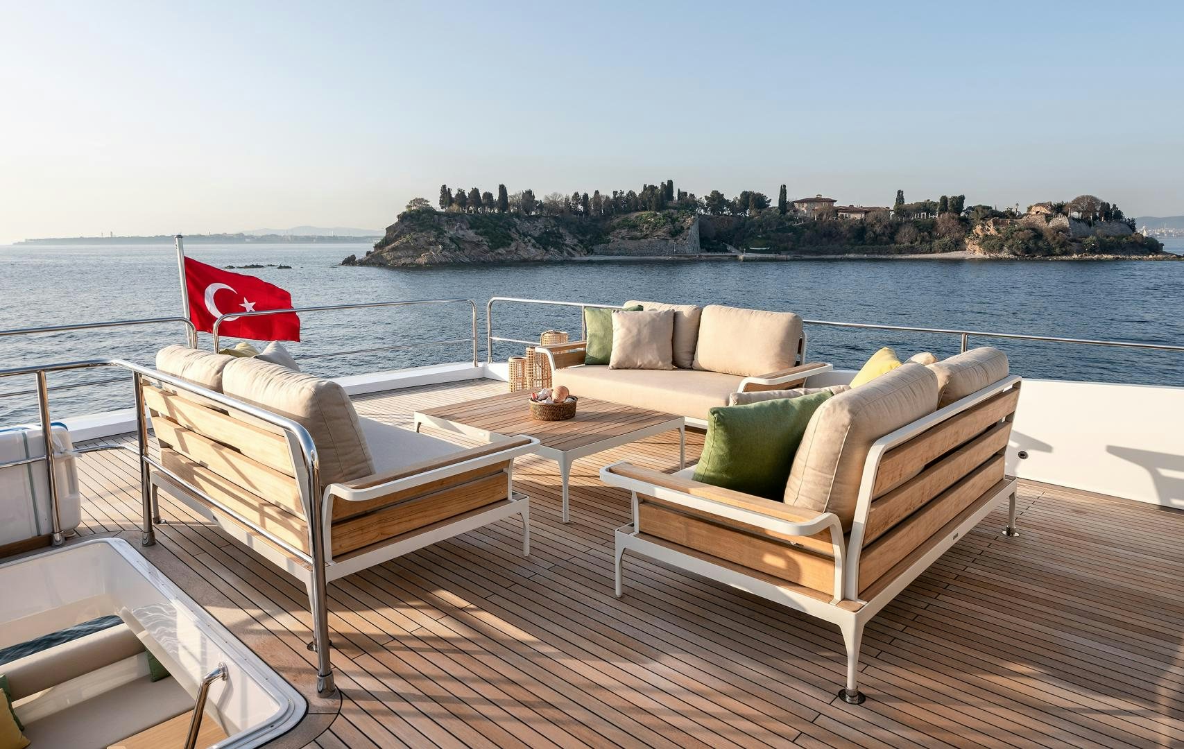 a deck with chairs and a table on it aboard NUMARINE 22XP Yacht for Sale