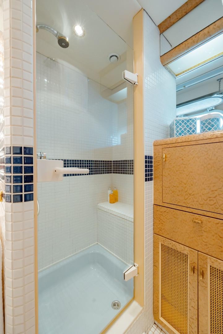 a bathroom with a shower aboard CAPRICE Yacht for Sale