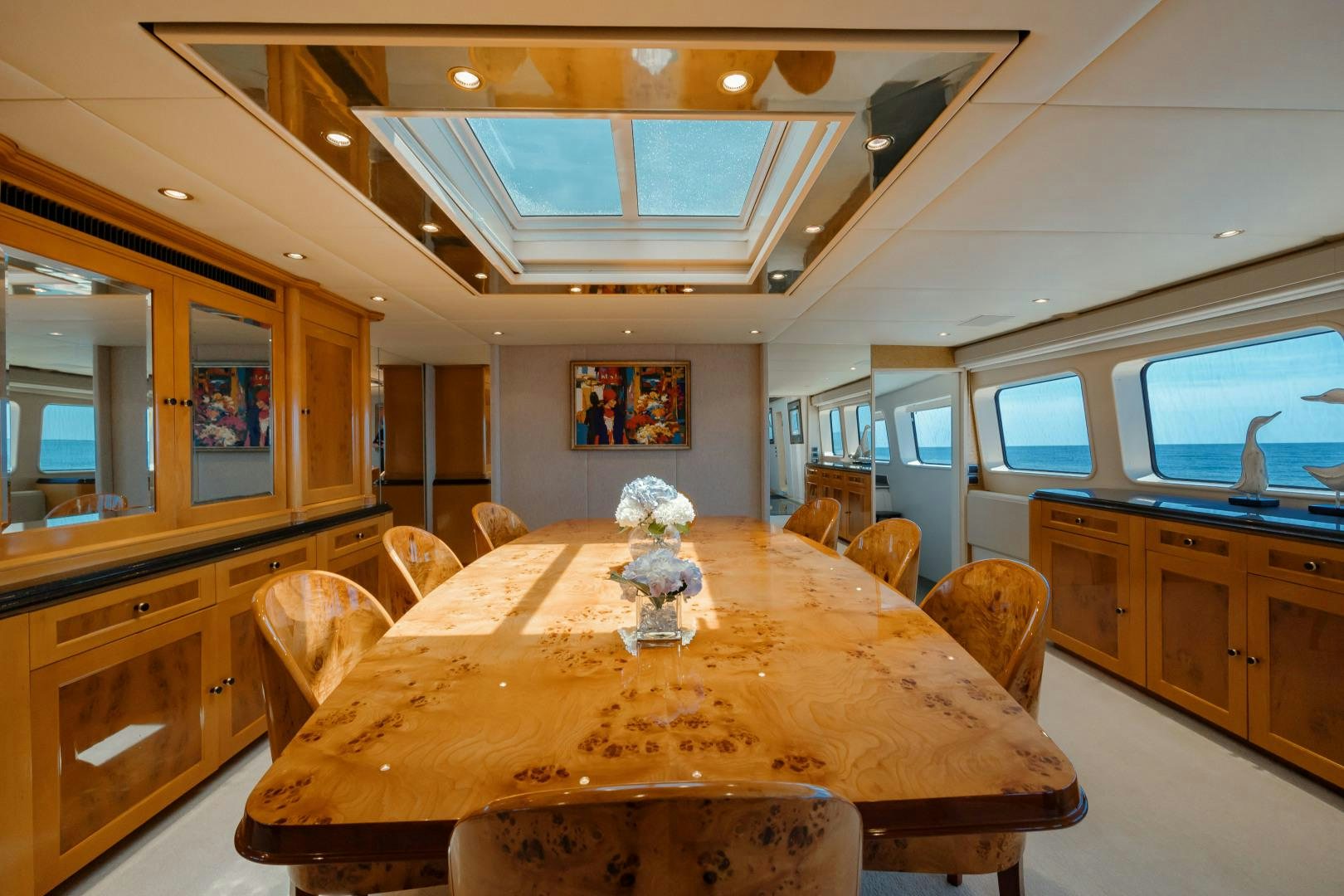 a dining table in a kitchen aboard CAPRICE Yacht for Sale
