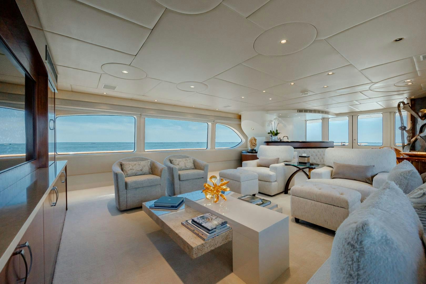 a living room with a large window aboard CAPRICE Yacht for Sale
