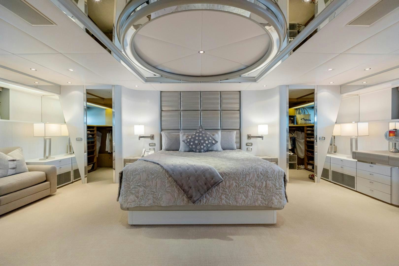a large room with a bed and a large mirror aboard CAPRICE Yacht for Sale