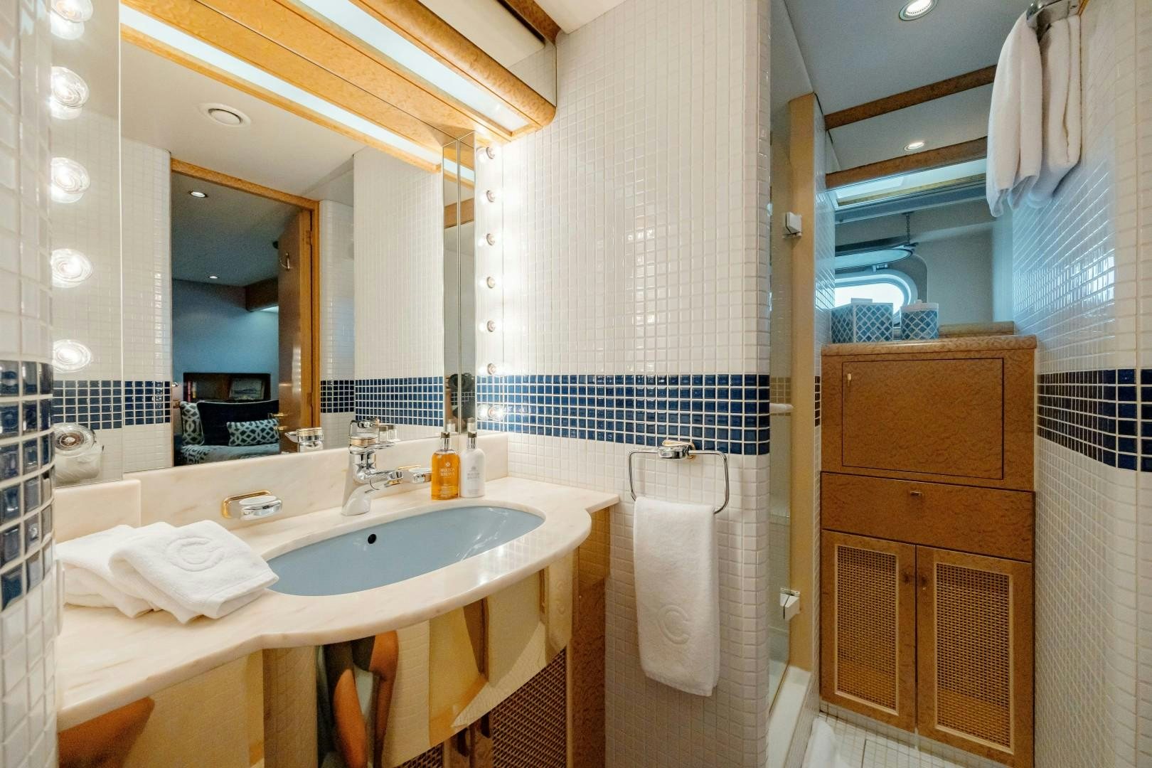 a bathroom with a sink and a mirror aboard CAPRICE Yacht for Sale