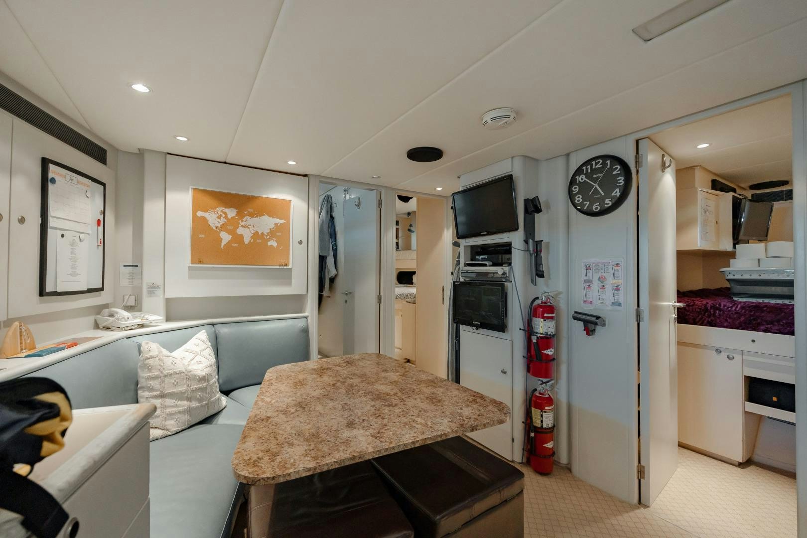 a small kitchen with a table aboard CAPRICE Yacht for Sale