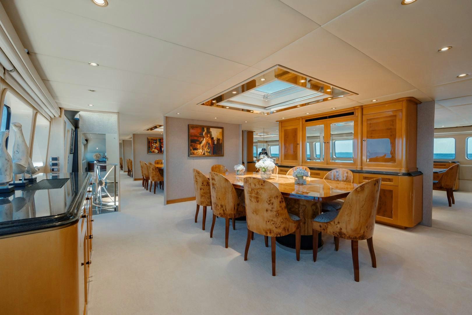 a dining room with a table aboard CAPRICE Yacht for Sale