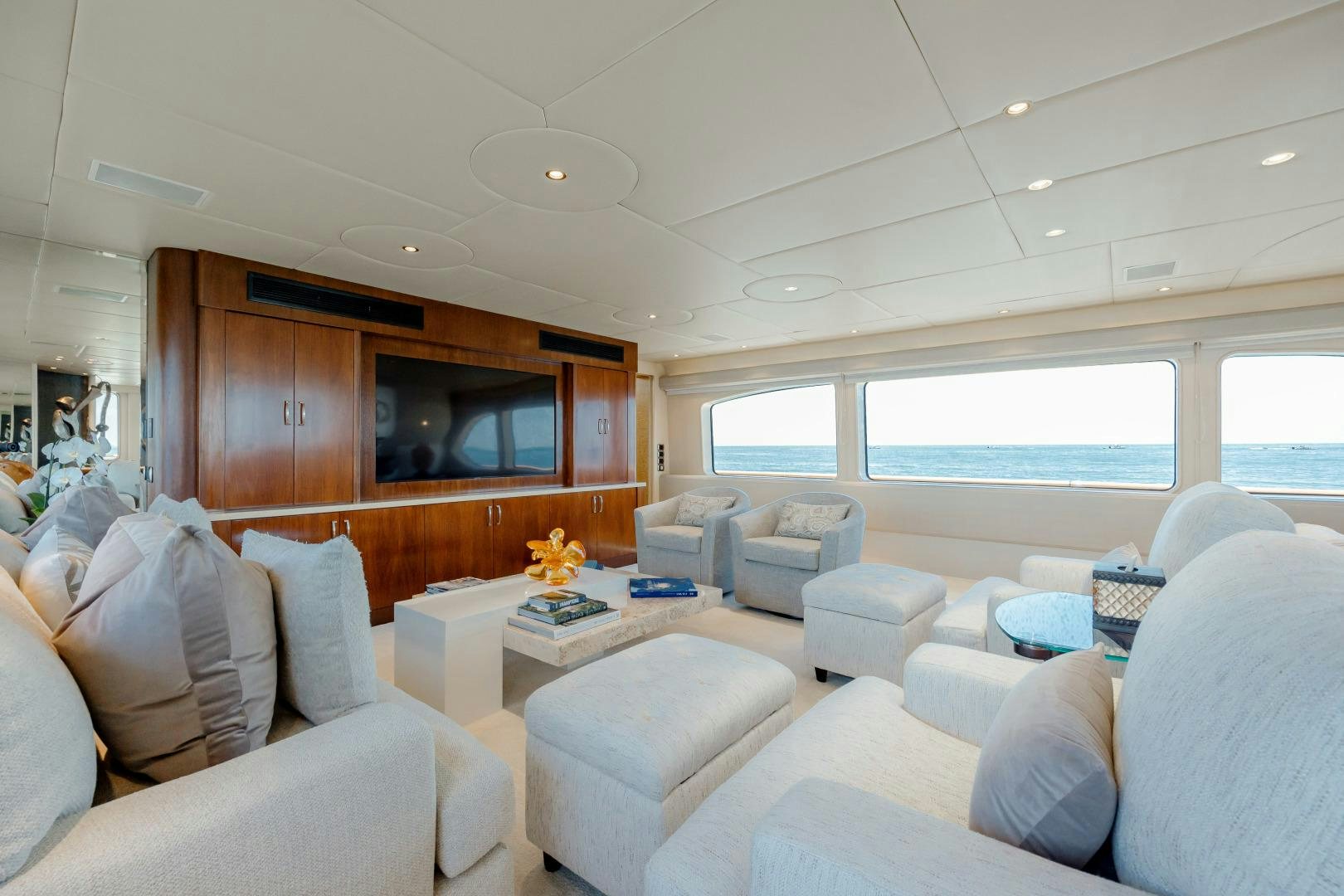 a living room with a large window aboard CAPRICE Yacht for Sale