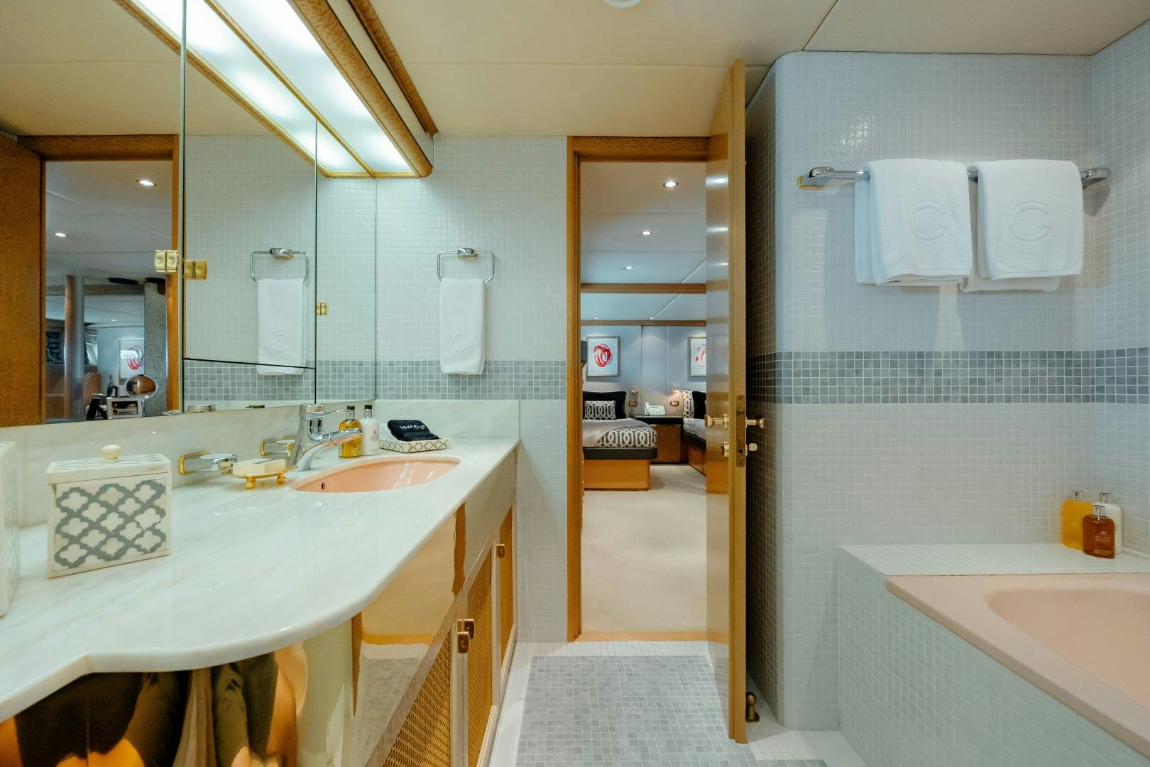 a bathroom with a sink and a mirror aboard CAPRICE Yacht for Sale
