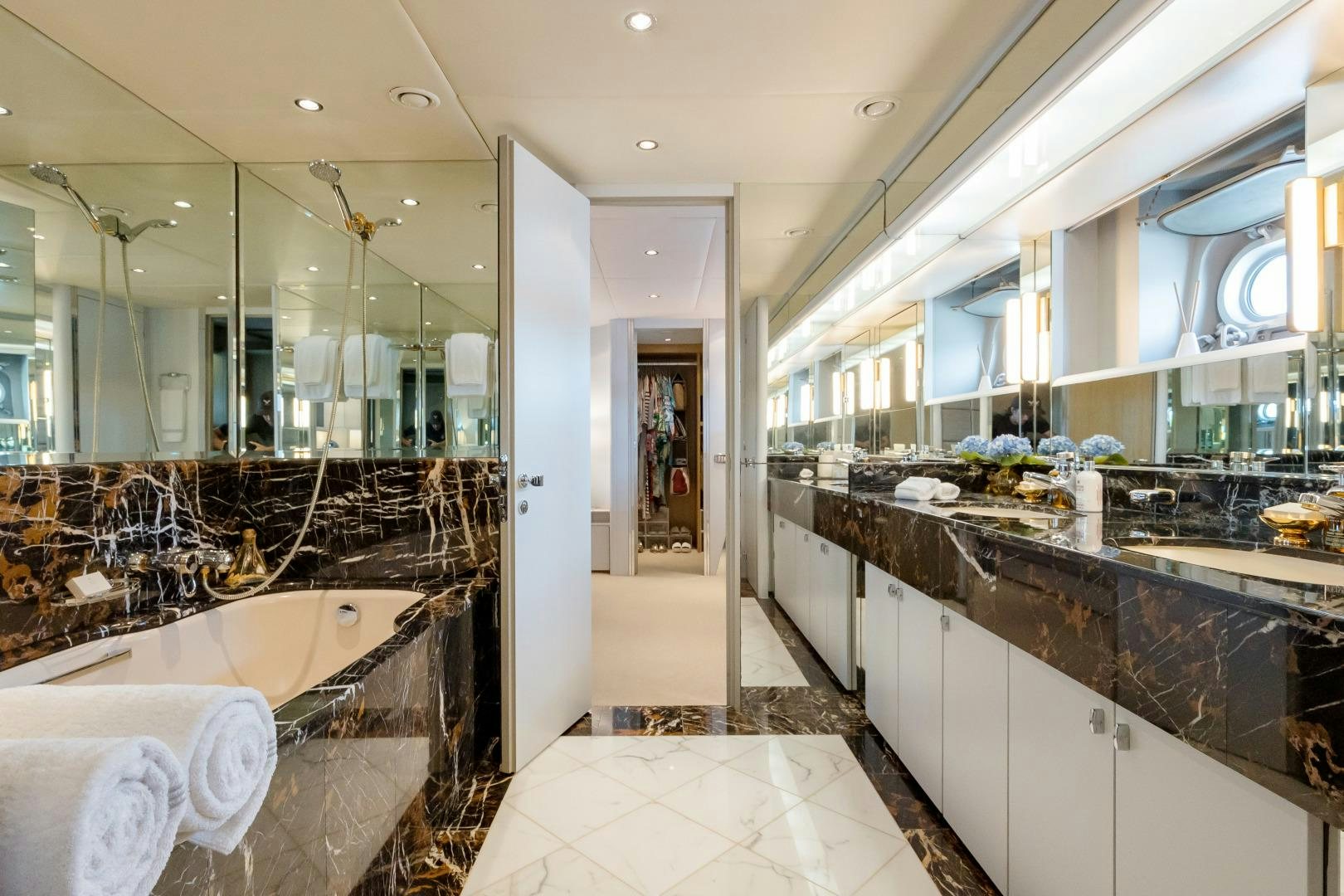 a large bathroom with a large tub aboard CAPRICE Yacht for Sale