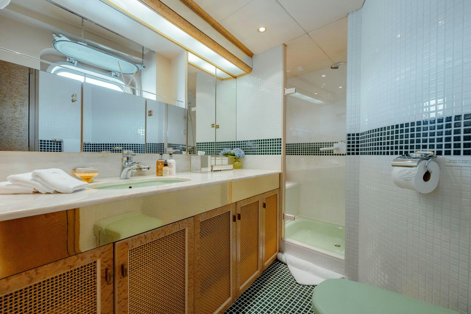 a bathroom with a sink and a bathtub aboard CAPRICE Yacht for Sale