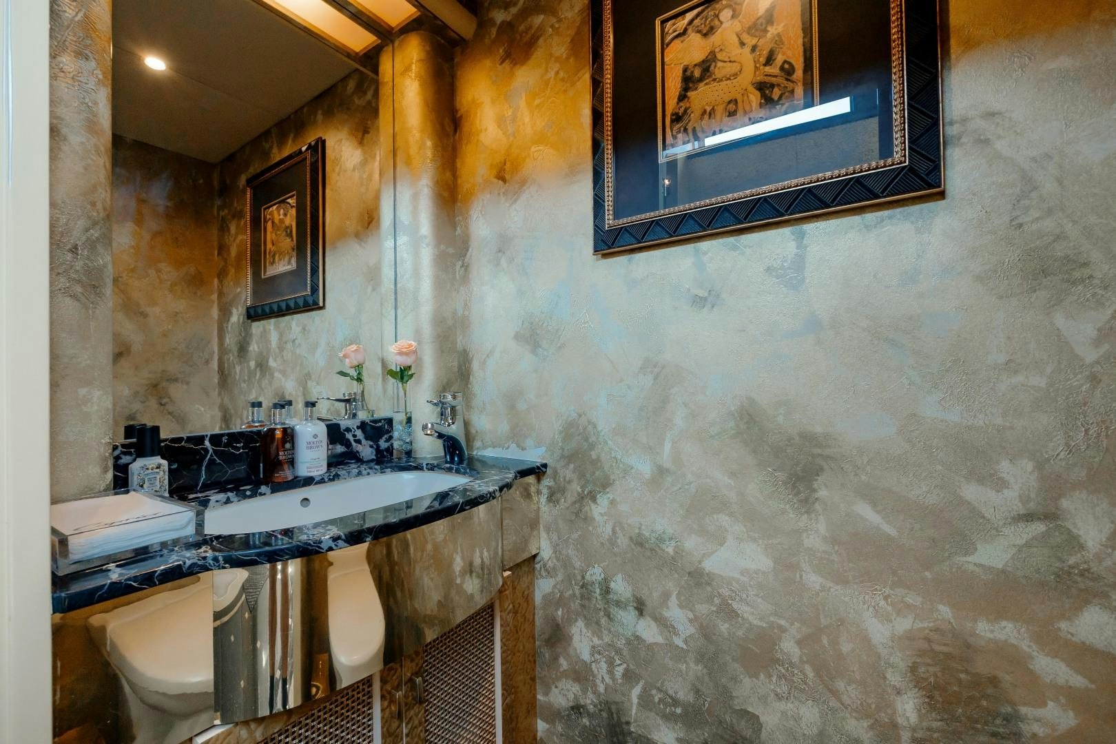 a bathroom with a sink and a toilet aboard CAPRICE Yacht for Sale