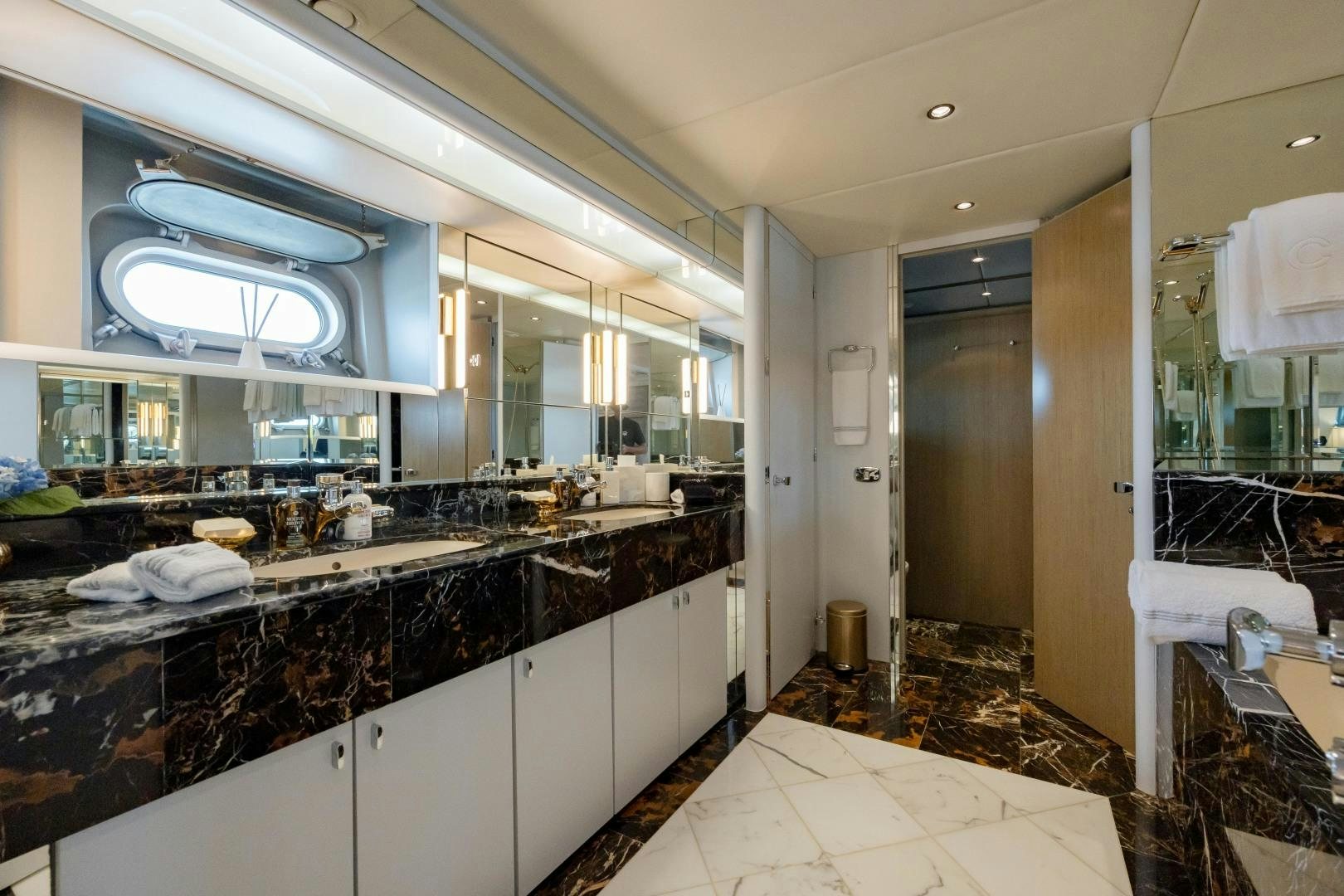 a bathroom with a large mirror aboard CAPRICE Yacht for Sale