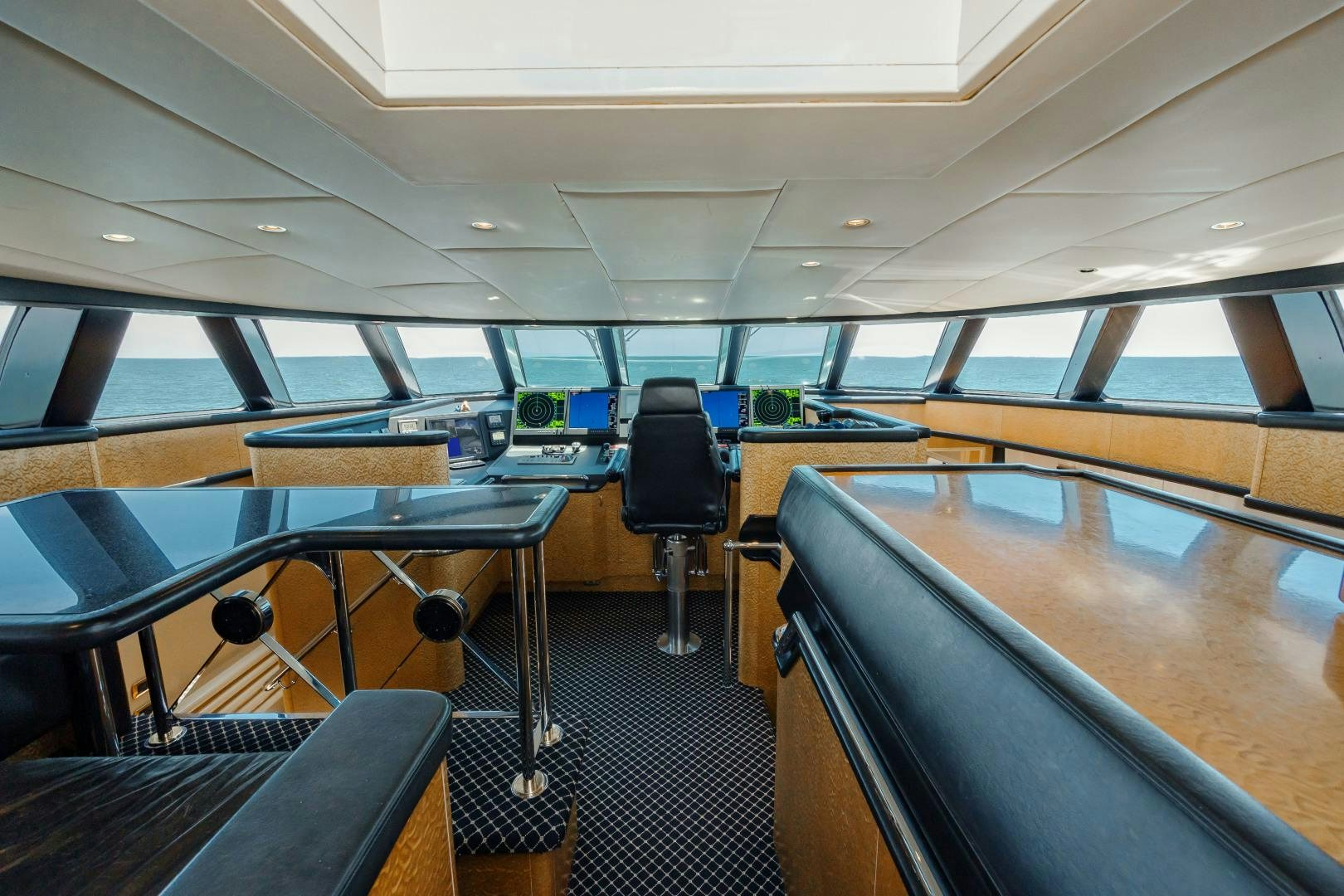 inside of a vehicle with seats and a steering wheel aboard CAPRICE Yacht for Sale