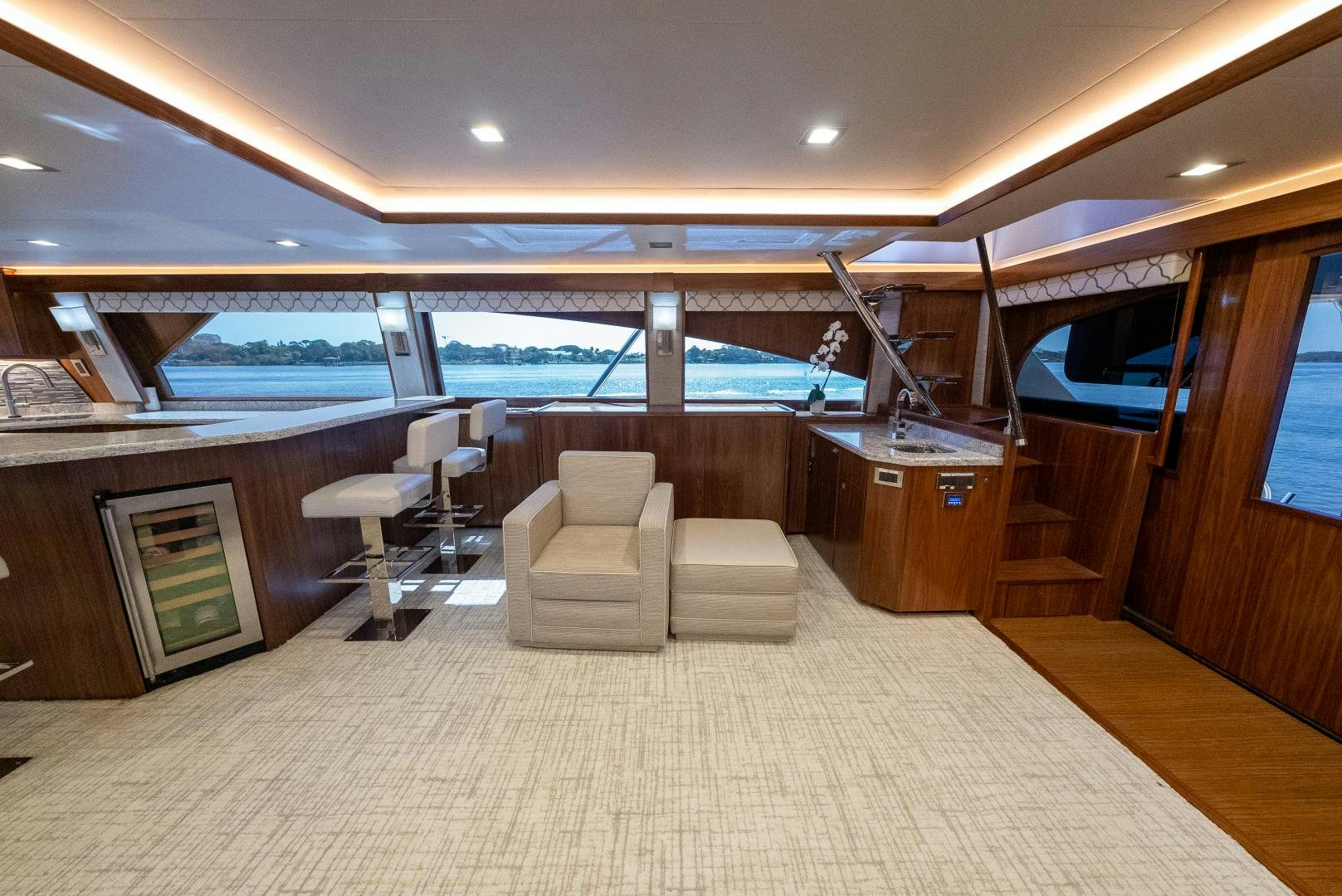 a room with a bed and a table and chairs aboard SIR' REEL Yacht for Sale