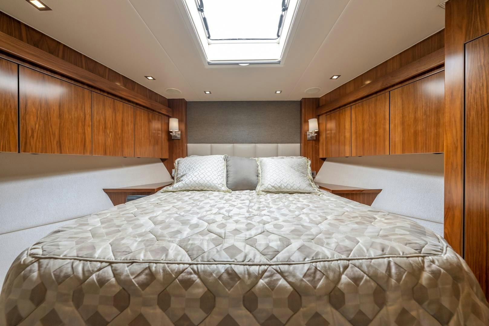 a bed with white sheets aboard SIR' REEL Yacht for Sale
