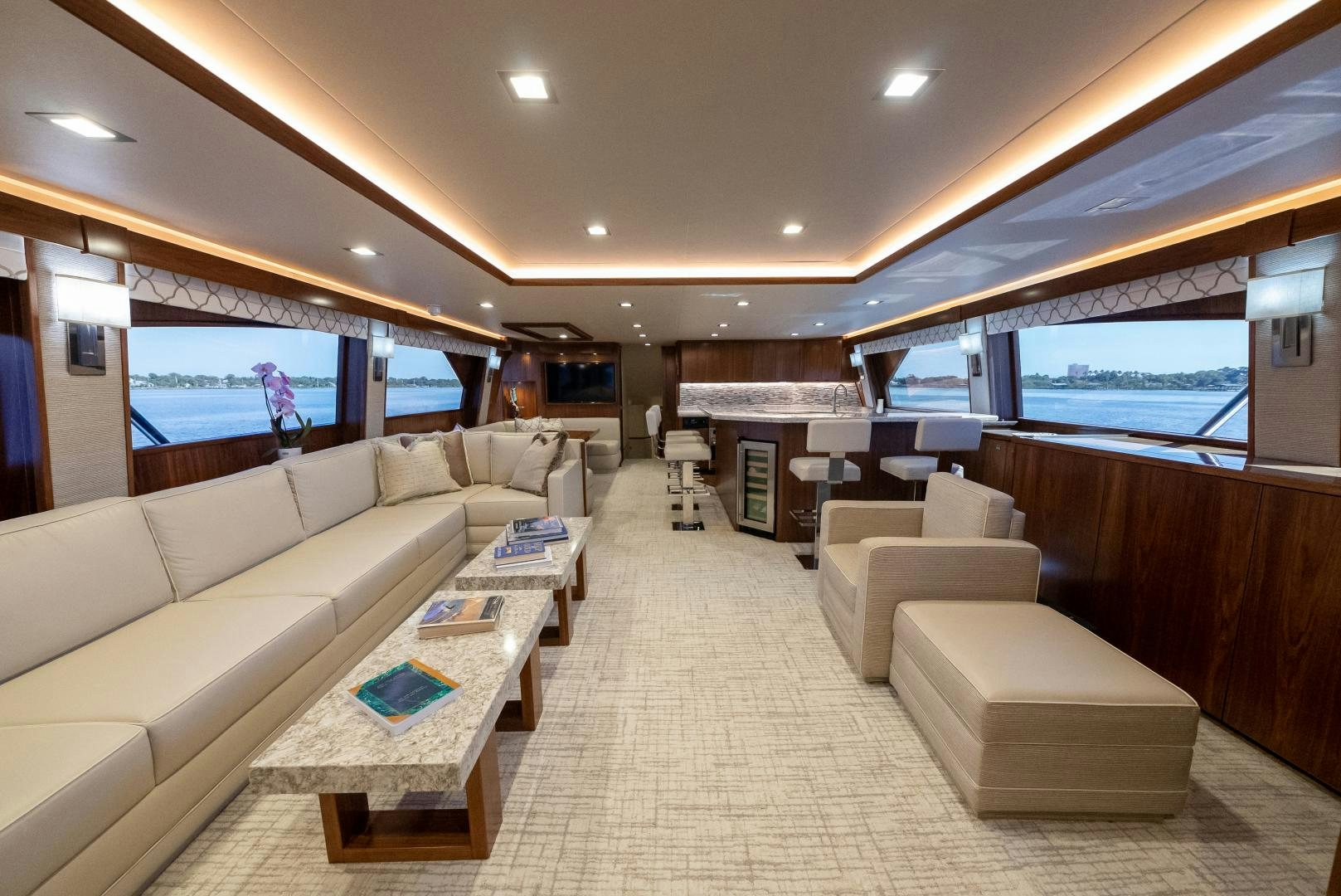a large living room with a large window aboard SIR' REEL Yacht for Sale