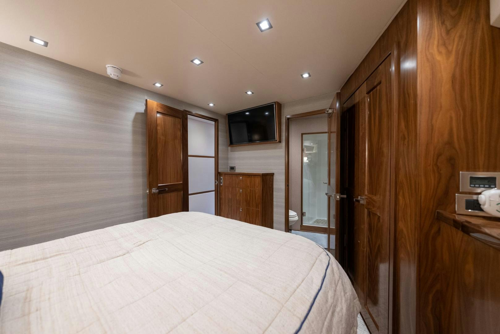 a bedroom with a bed aboard SIR' REEL Yacht for Sale