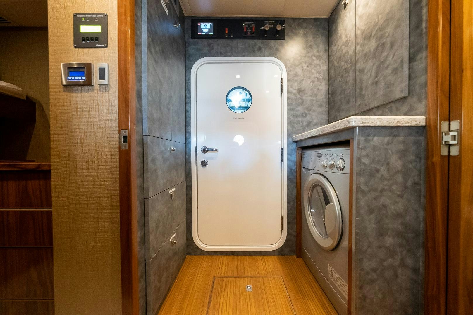 a washing machine in a room aboard SIR' REEL Yacht for Sale