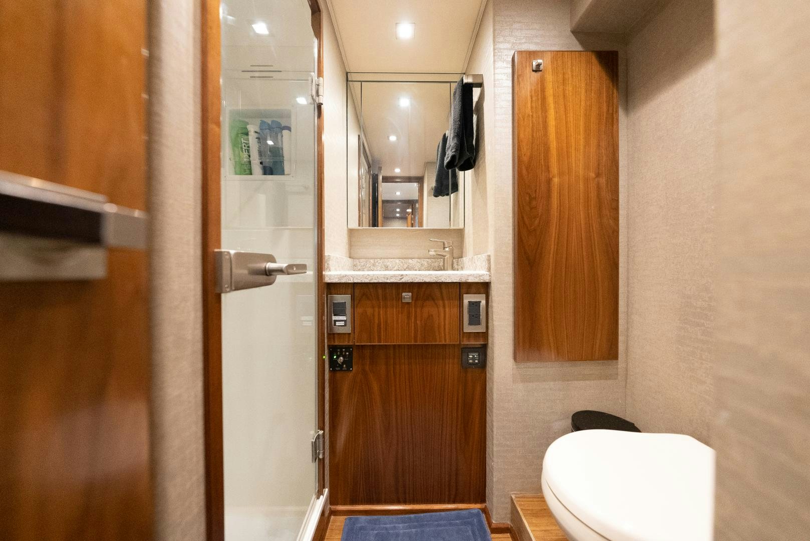 a bathroom with a toilet and a sink aboard SIR' REEL Yacht for Sale