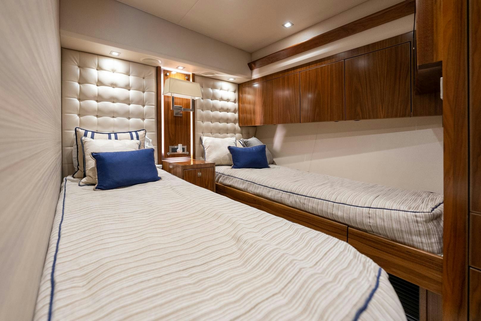 a couple of beds in a hotel room aboard SIR' REEL Yacht for Sale