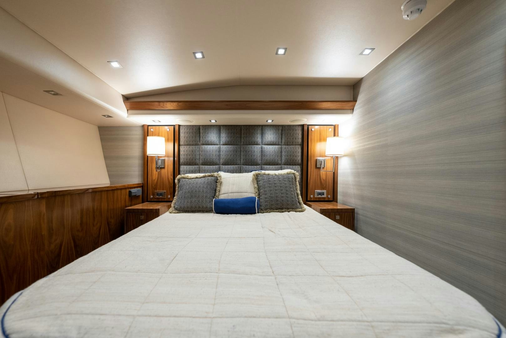 a bed with a white sheet aboard SIR' REEL Yacht for Sale