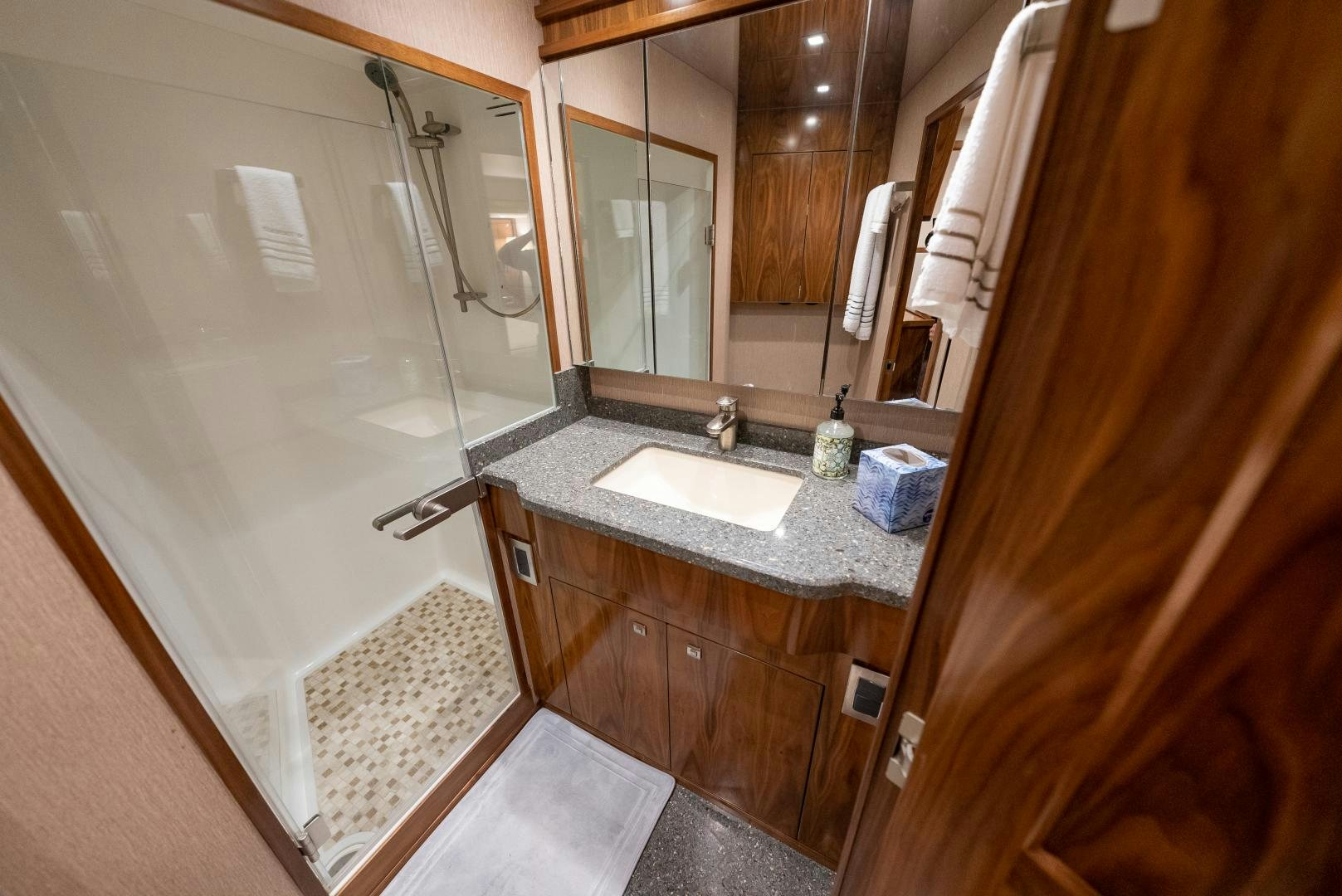 a bathroom with a sink and a shower aboard SIR' REEL Yacht for Sale