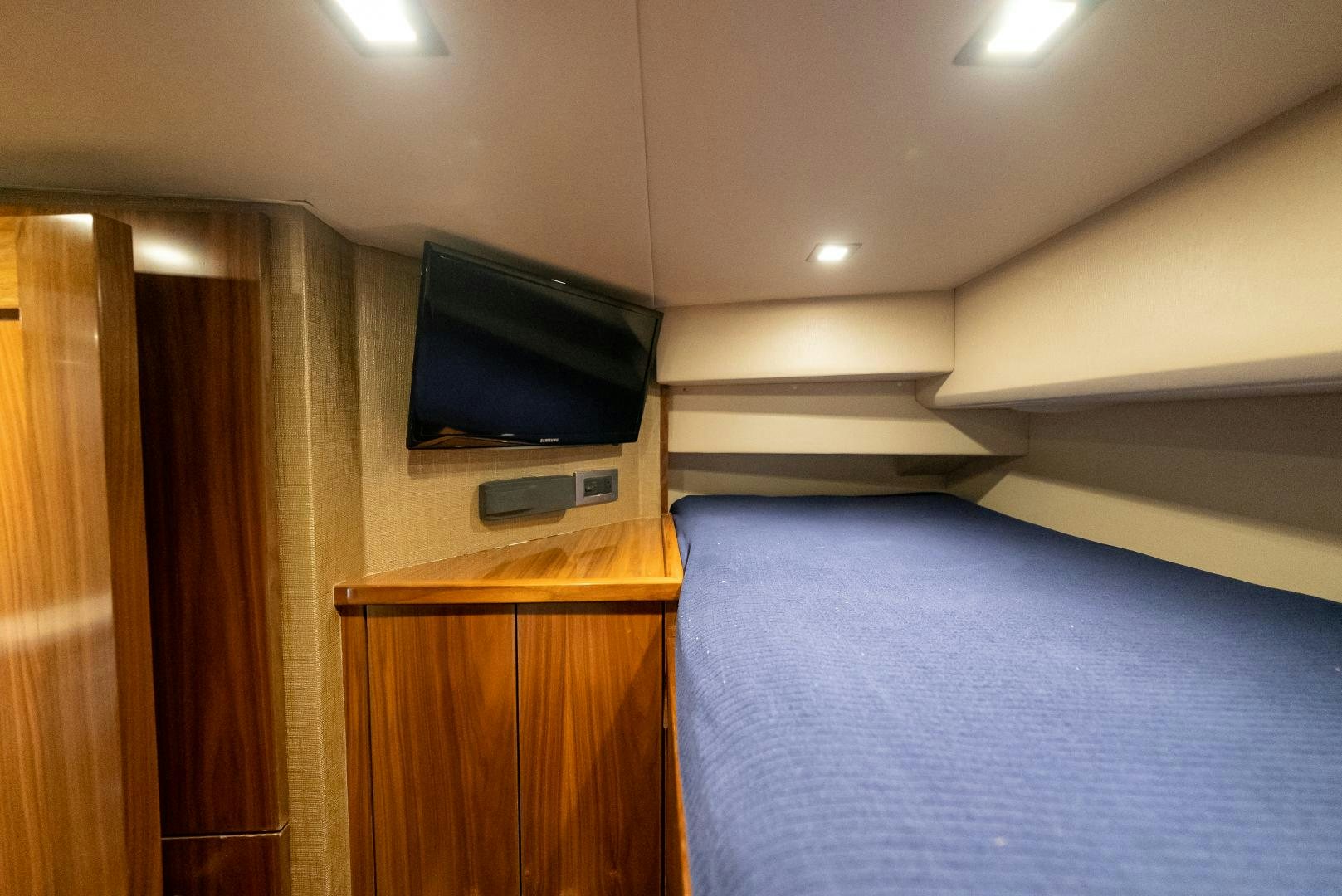 a tv on a wall aboard SIR' REEL Yacht for Sale