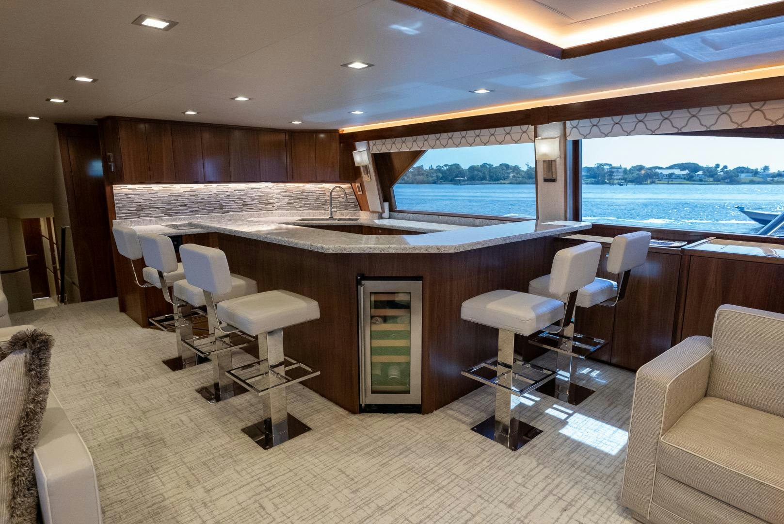 a large kitchen with a large island aboard SIR' REEL Yacht for Sale