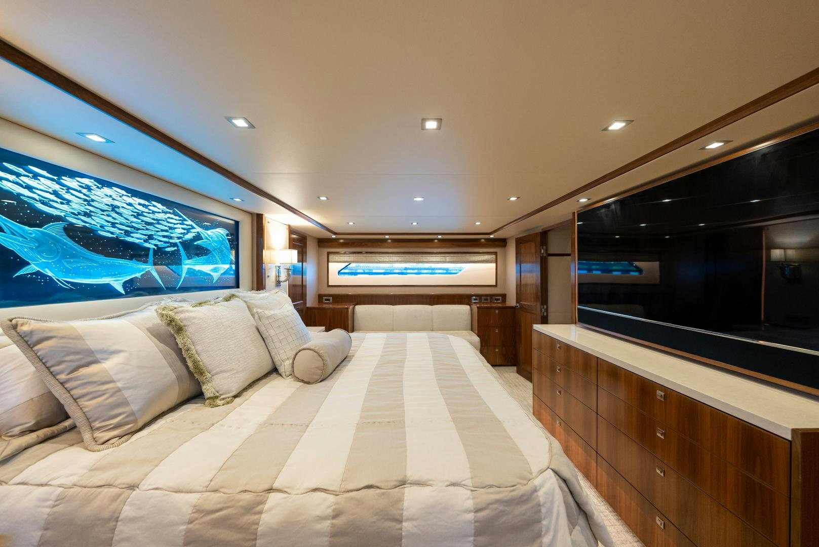 a large hotel room with a large screen aboard SIR' REEL Yacht for Sale