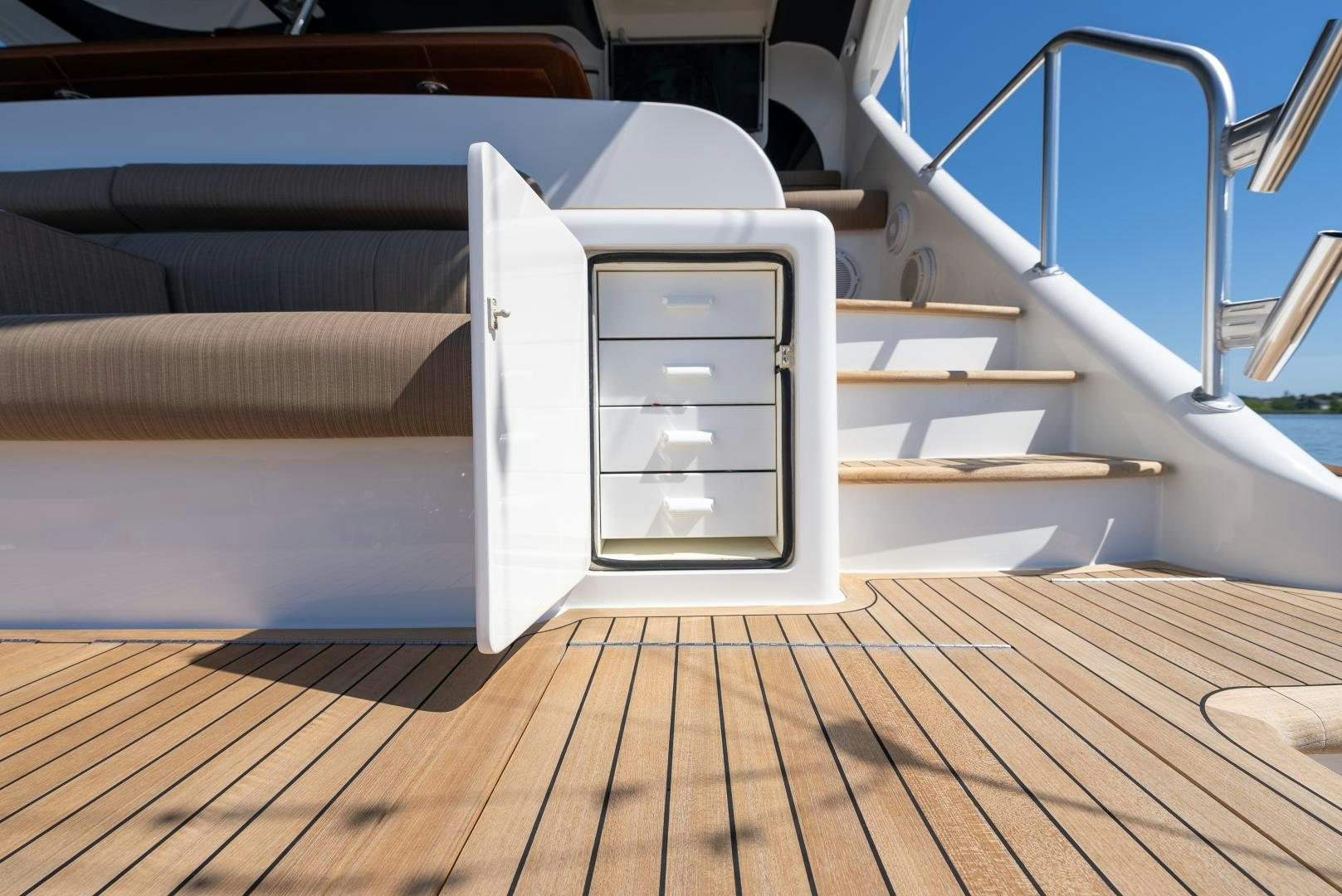 a white box on a wooden floor aboard SIR' REEL Yacht for Sale