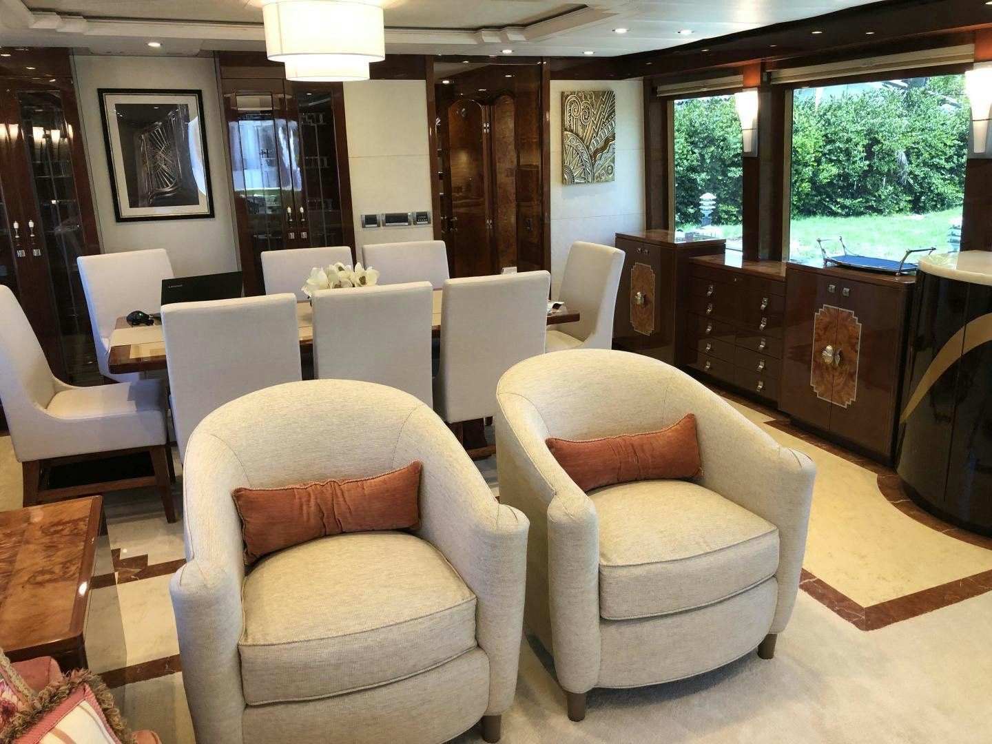 a room with chairs and a table aboard ADVENTURE US II Yacht for Sale