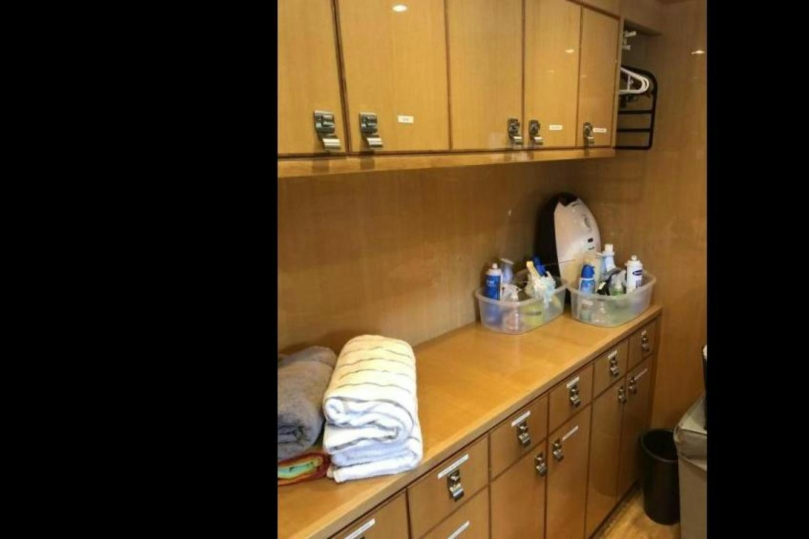 a kitchen with wooden cabinets aboard ADVENTURE US II Yacht for Sale