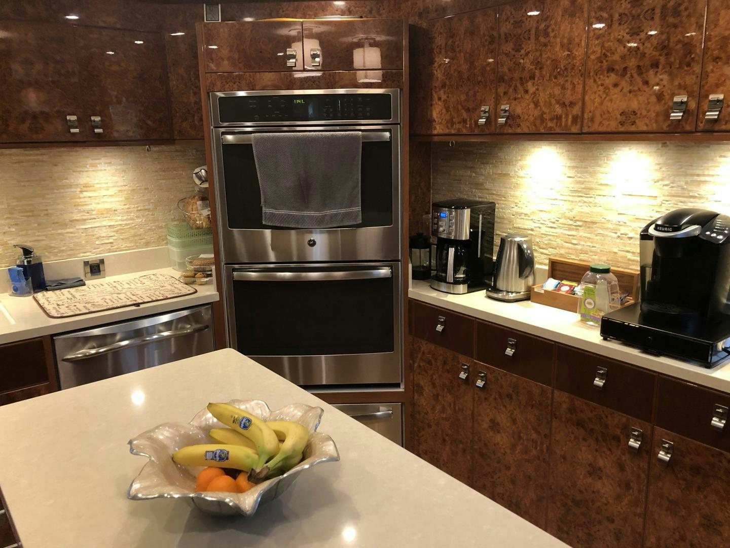 a kitchen with a stainless steel oven aboard ADVENTURE US II Yacht for Sale