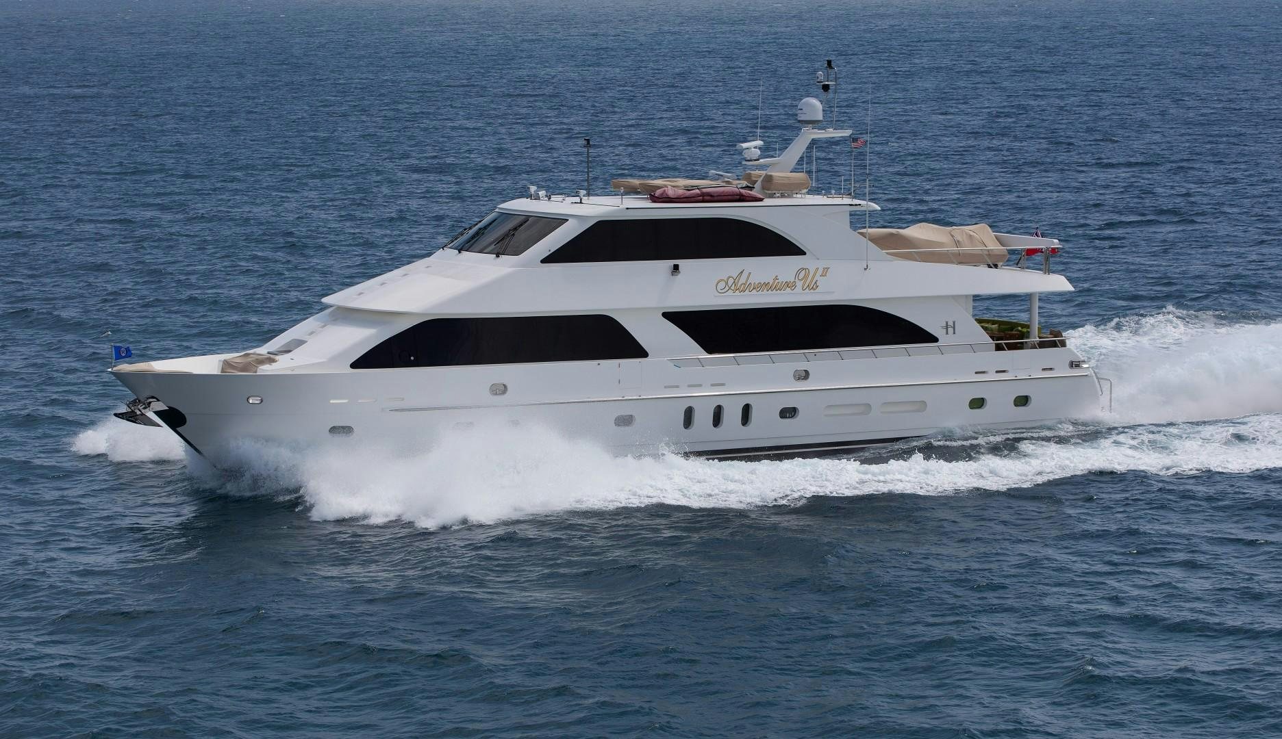 a white yacht on the water aboard ADVENTURE US II Yacht for Sale