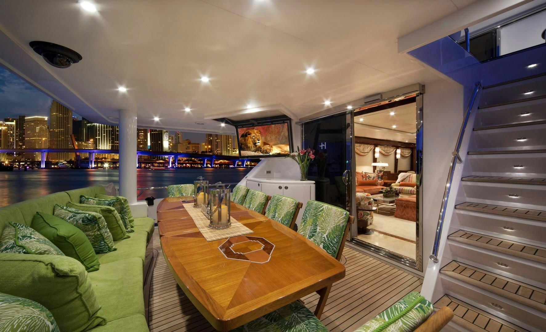 a room with a table and chairs aboard ADVENTURE US II Yacht for Sale