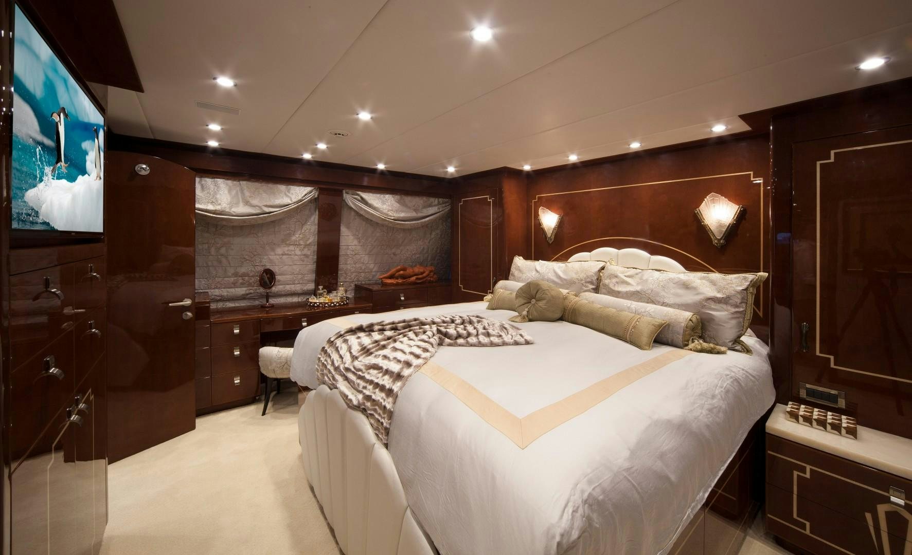 a bedroom with a large bed aboard ADVENTURE US II Yacht for Sale