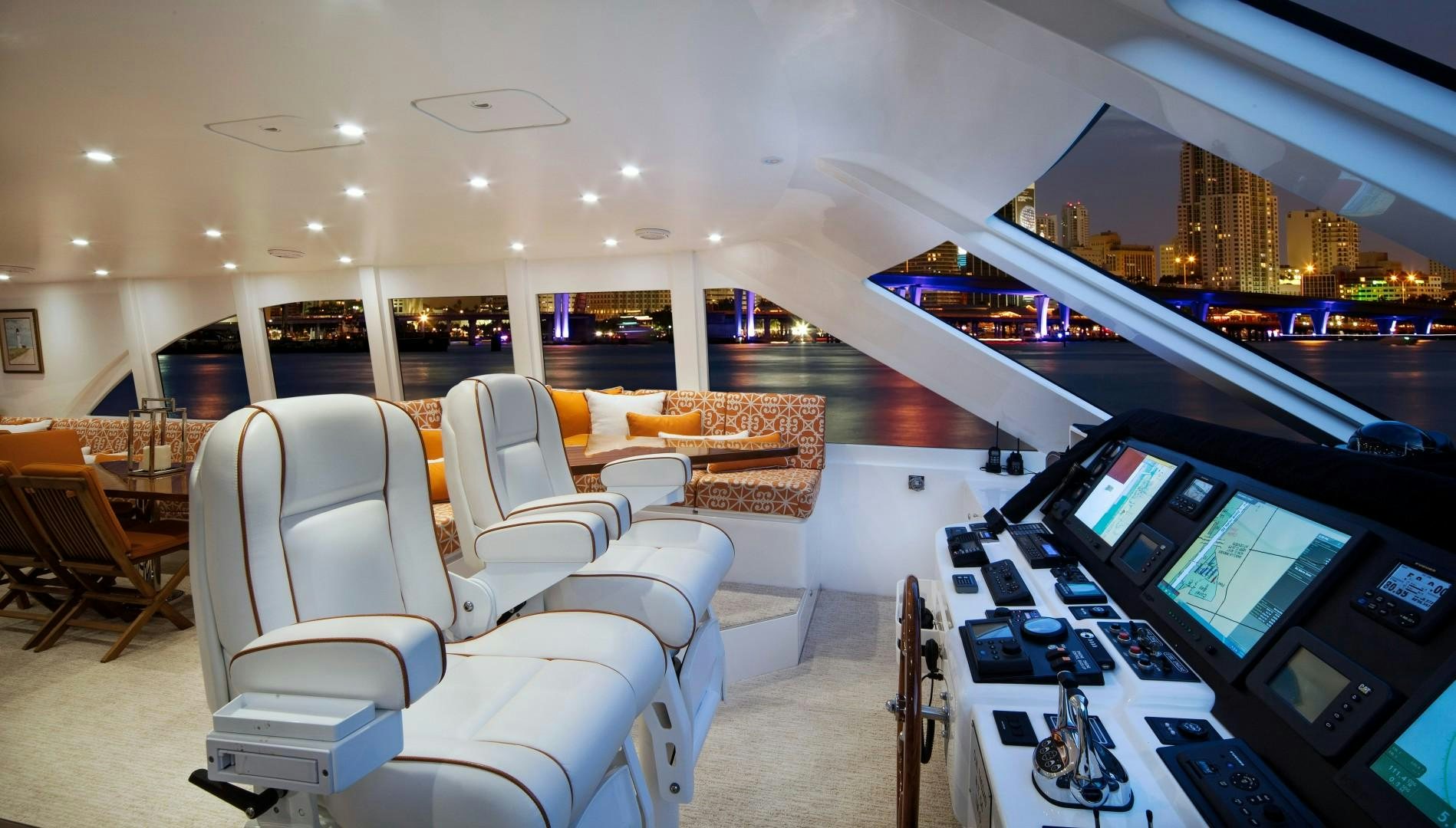 a room with a table and chairs aboard ADVENTURE US II Yacht for Sale