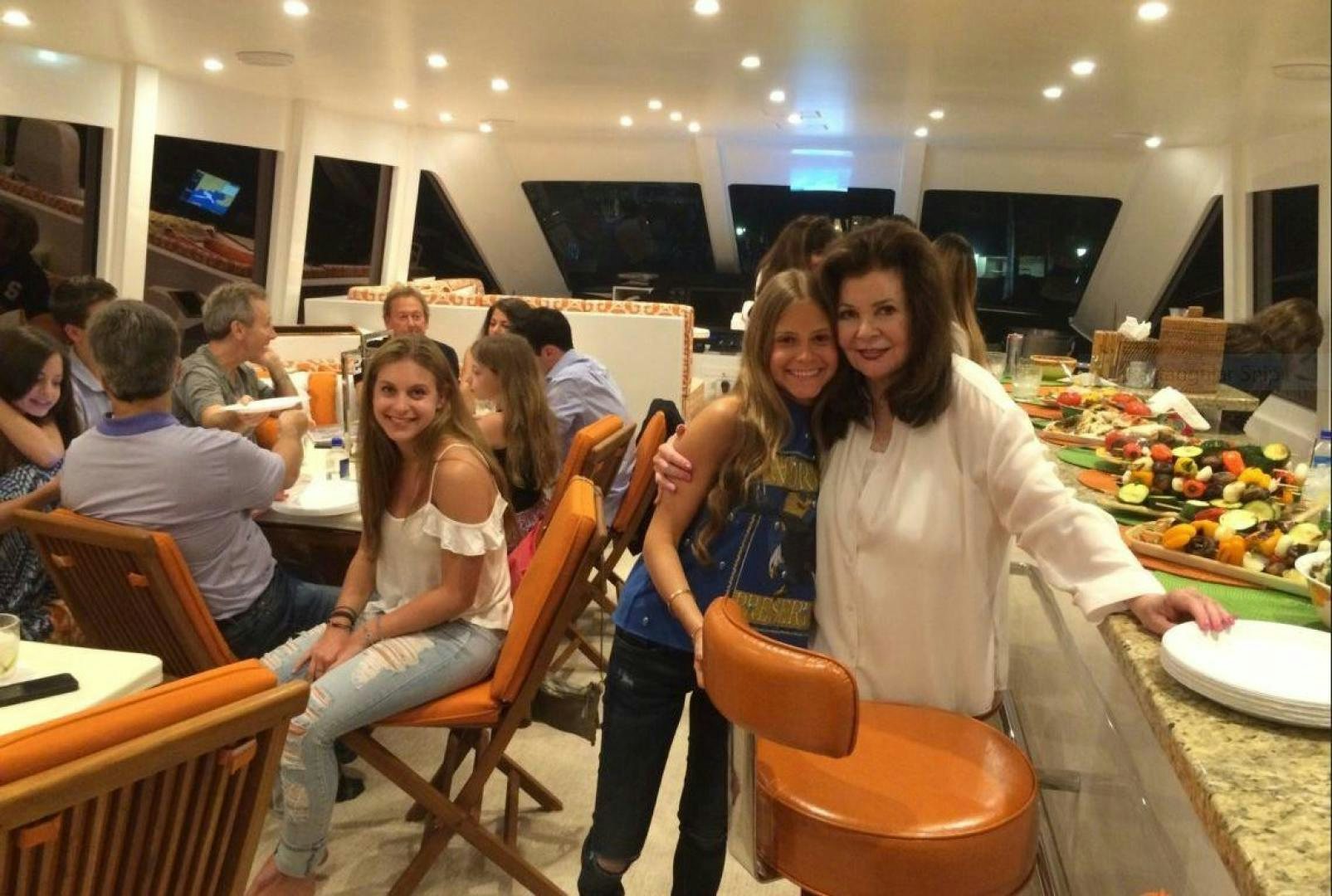 a group of people sitting at tables aboard ADVENTURE US II Yacht for Sale